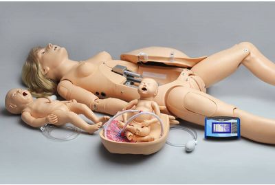 All the parts and accessories for the NOELLE patient simulator and resuscitation baby are spread out for display.