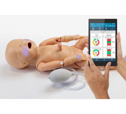 Premie Blue premature newborn patient simulator with SmartSkin and OMNI2 lying down with cyanosis on face and hands.